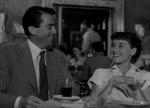 Drinking champaign for breakfast (Hepburn with Peck)